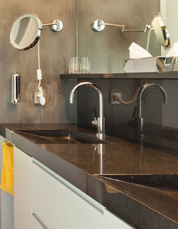 bathroom sink and mirror, shiny dark counter